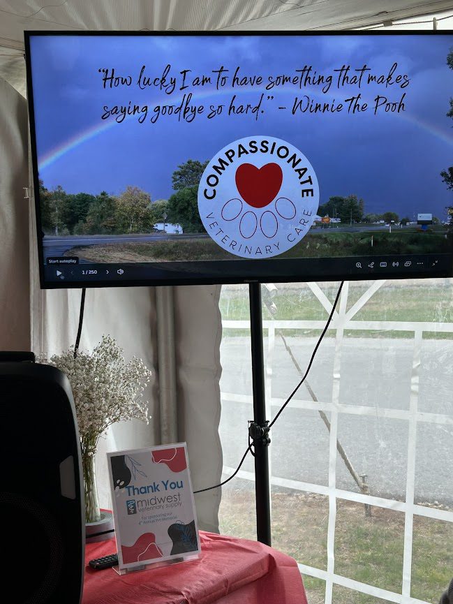 Tv screen showing pet memorial slideshow